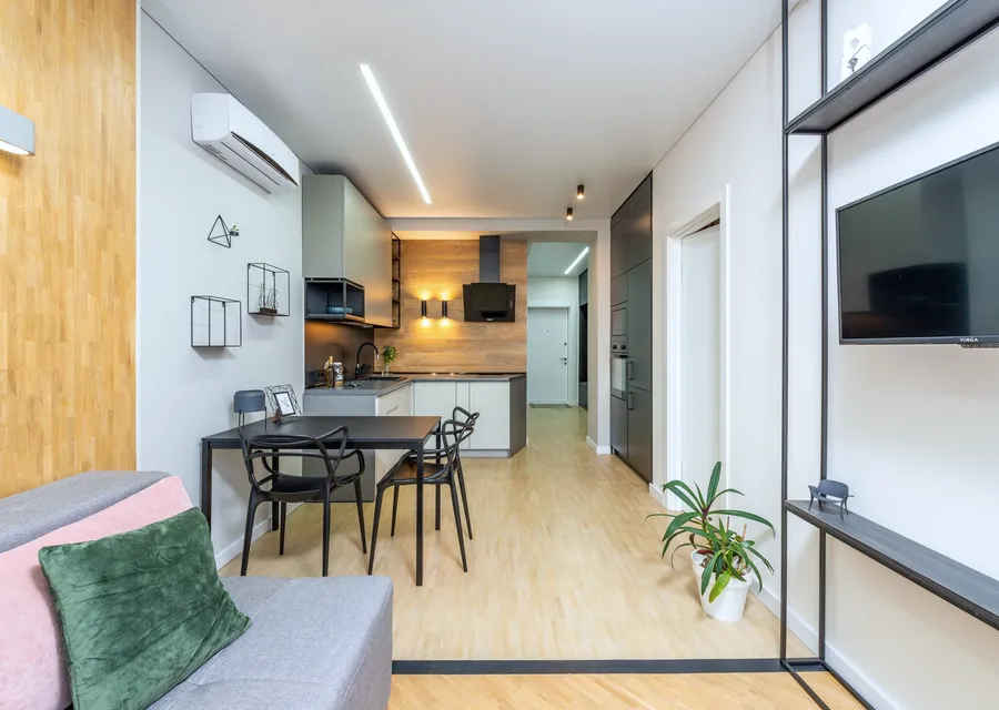 Open-plan living space with a discreet wall-mounted air-conditioning unit